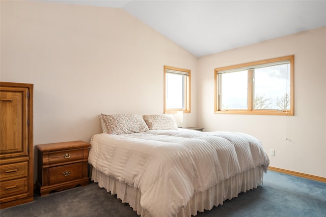 5190 Goodan Ln, Missoula, MT 59808 - bedroom with dark carpet, vaulted ceiling, and baseboards