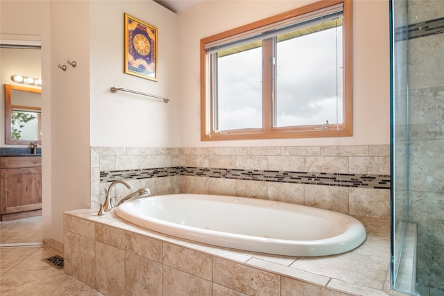 5190 Goodan Ln, Missoula, MT 59808 - bathroom featuring a garden tub, tile patterned flooring, and vanity