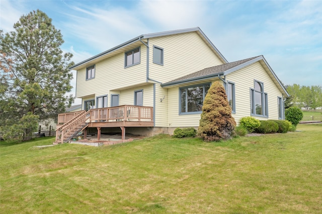 5190 Goodan Ln, Missoula, MT 59808 - back of house featuring a wooden deck, a lawn, and stairs