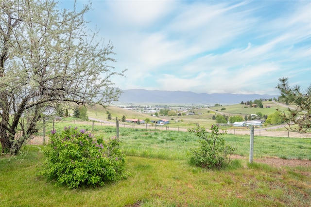 5190 Goodan Ln, Missoula, MT 59808 - view of yard featuring a view of countryside, a mountain view, and fence