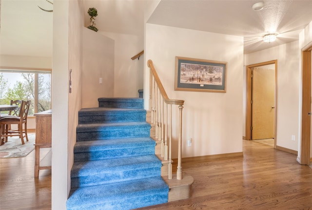 5190 Goodan Ln, Missoula, MT 59808 - staircase with wood finished floors and baseboards