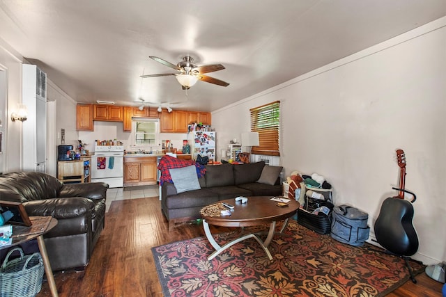 living room featuring wood finished floors and ceiling fan