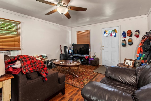 living room with wood finished floors and ceiling fan