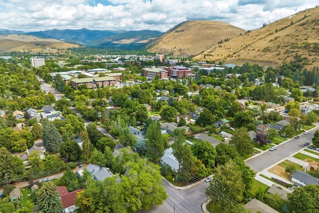 aerial view of property's location featuring a mountain backdrop