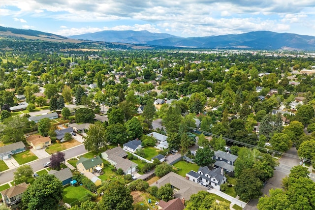 aerial view of residential area featuring mountains