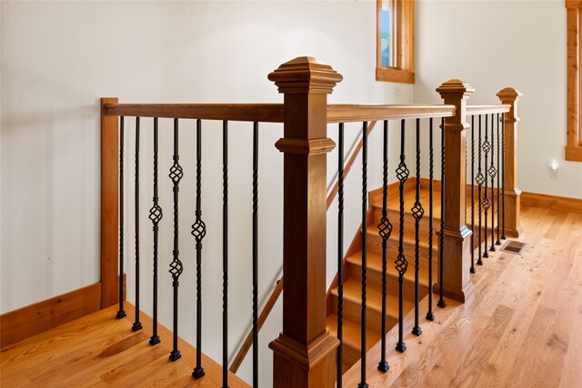 15222 Mt Highway 35, Bigfork, MT 59911 - staircase featuring wood finished floors and baseboards