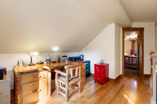 15222 Mt Highway 35, Bigfork, MT 59911 - home office featuring light wood-type flooring, lofted ceiling, and baseboards