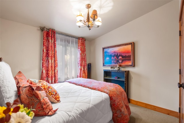 15222 Mt Highway 35, Bigfork, MT 59911 - carpeted bedroom with a chandelier, lofted ceiling, and baseboards