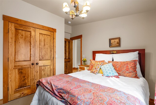 15222 Mt Highway 35, Bigfork, MT 59911 - bedroom featuring a chandelier, carpet, and a closet