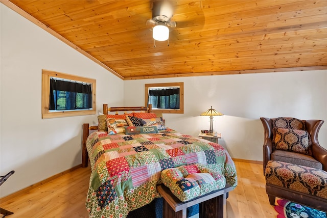 15222 Mt Highway 35, Bigfork, MT 59911 - bedroom with vaulted ceiling, wood ceiling, baseboards, light wood-style floors, and a ceiling fan
