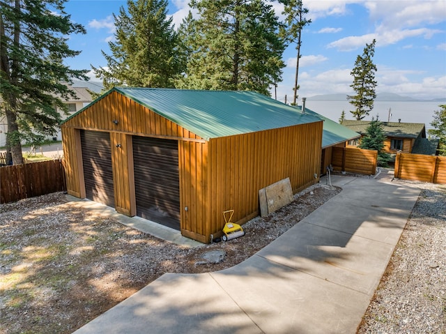 15222 Mt Highway 35, Bigfork, MT 59911 - detached garage featuring fence and a water view