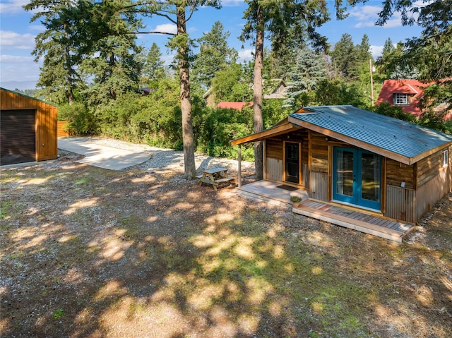 15222 Mt Highway 35, Bigfork, MT 59911 - view of yard with an outbuilding, a garage, and french doors