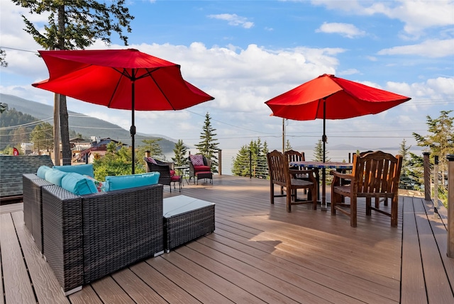 15222 Mt Highway 35, Bigfork, MT 59911 - deck with outdoor dining space and a mountain view