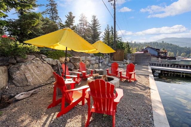 15222 Mt Highway 35, Bigfork, MT 59911 - view of patio / terrace featuring an outdoor fire pit and a mountain view