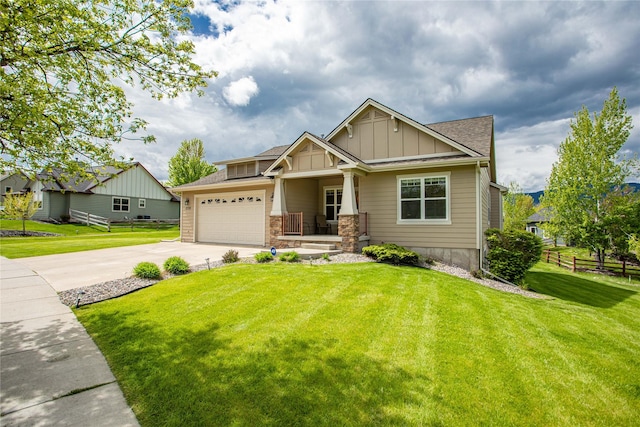 2719 Carnoustie Way, Missoula, MT 59808 - craftsman-style house with board and batten siding, concrete driveway, covered porch, an attached garage, and roof with shingles
