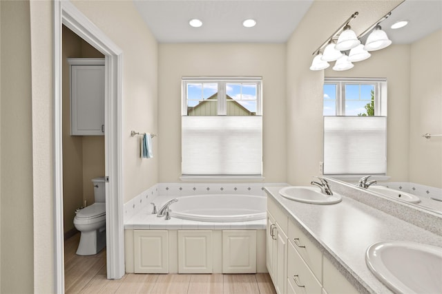 2719 Carnoustie Way, Missoula, MT 59808 - bathroom with toilet, a garden tub, double vanity, and recessed lighting