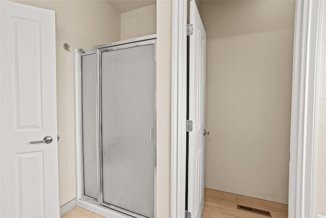 2719 Carnoustie Way, Missoula, MT 59808 - bathroom featuring a shower stall and wood finished floors
