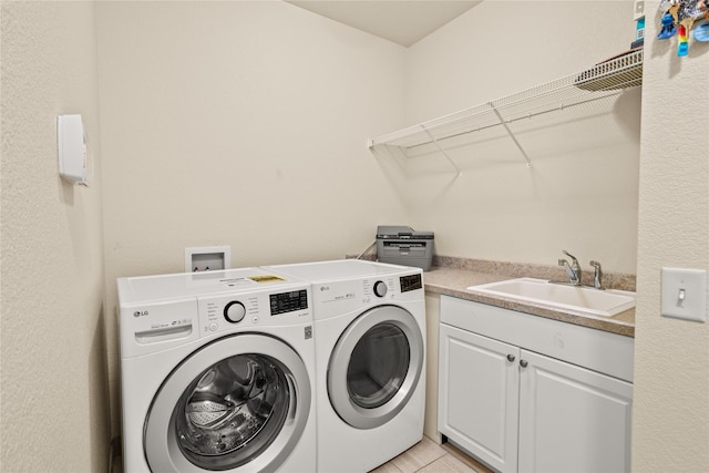 2719 Carnoustie Way, Missoula, MT 59808 - laundry area with washing machine and clothes dryer and cabinet space