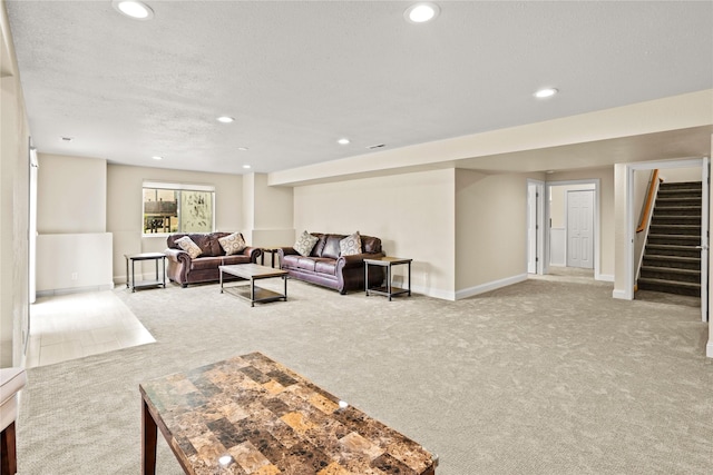 2719 Carnoustie Way, Missoula, MT 59808 - living area featuring carpet flooring, stairway, recessed lighting, baseboards, and a textured ceiling