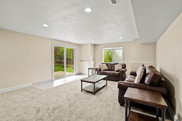 2719 Carnoustie Way, Missoula, MT 59808 - living area with a textured ceiling, recessed lighting, light carpet, and baseboards
