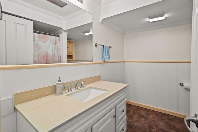 2719 Carnoustie Way, Missoula, MT 59808 - full bath with vanity, a wainscoted wall, curtained shower, and wooden walls