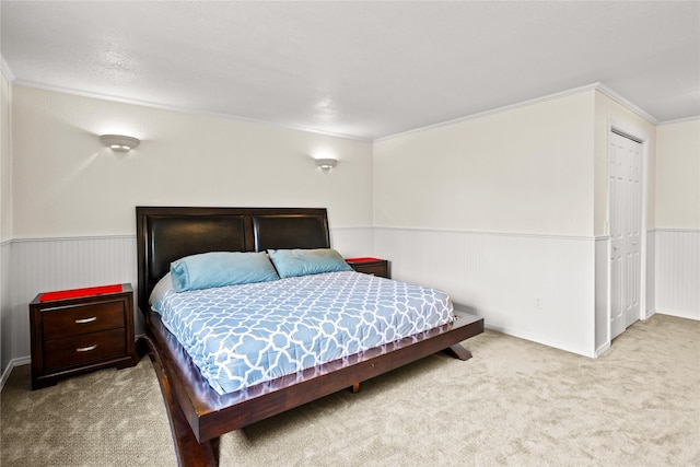 2719 Carnoustie Way, Missoula, MT 59808 - bedroom with carpet floors, a wainscoted wall, and ornamental molding