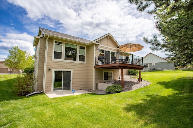 2719 Carnoustie Way, Missoula, MT 59808 - rear view of property with a lawn, a patio, board and batten siding, and a wooden deck