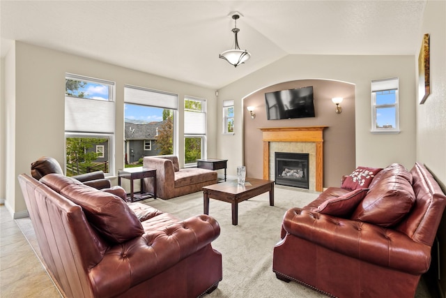 2719 Carnoustie Way, Missoula, MT 59808 - living room with vaulted ceiling, a fireplace, and light colored carpet