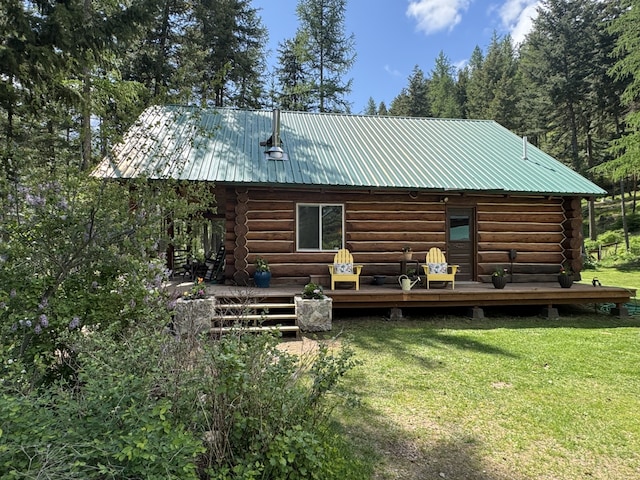 2041 Petty Creek Rd, Alberton, MT 59820 - rear view of house with log exterior, a yard, and a wooden deck