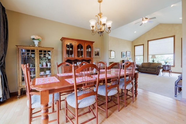 4340 Fox View Loop, Helena, MT 59602 - dining space featuring a ceiling fan, vaulted ceiling, a chandelier, and light wood-style floors