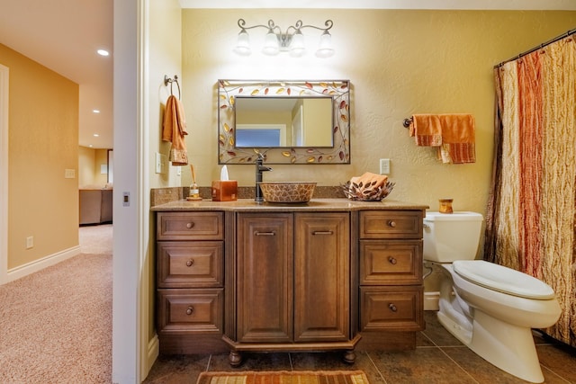 4340 Fox View Loop, Helena, MT 59602 - bathroom with toilet, vanity, recessed lighting, and baseboards