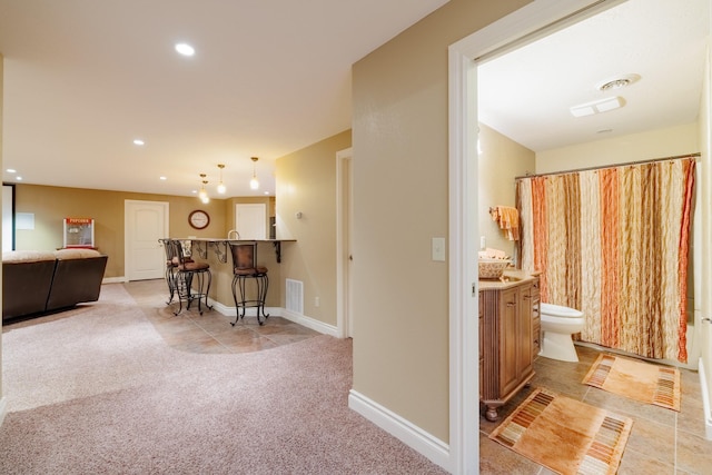 4340 Fox View Loop, Helena, MT 59602 - hall featuring light colored carpet, baseboards, and recessed lighting