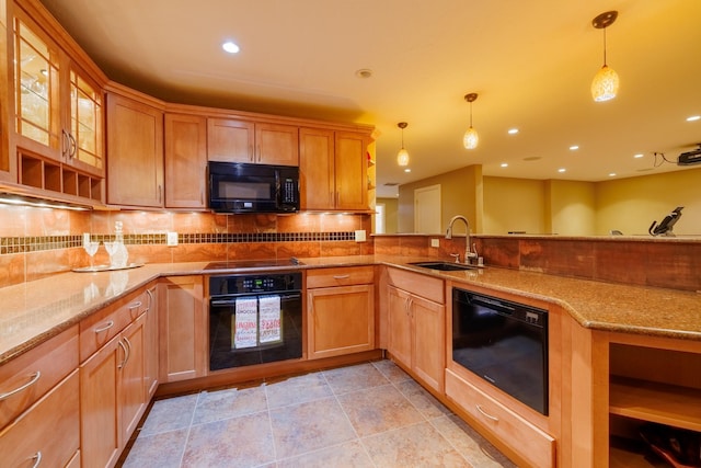 4340 Fox View Loop, Helena, MT 59602 - kitchen featuring black appliances, a sink, light stone countertops, tasteful backsplash, and recessed lighting