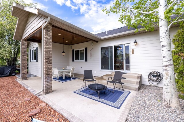 4340 Fox View Loop, Helena, MT 59602 - rear view of property featuring a patio and an outdoor fire pit