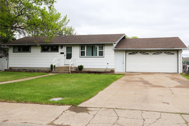 604 27th Ave NE, Great Falls, MT 59404 - ranch-style house with concrete driveway, a garage, and a front lawn
