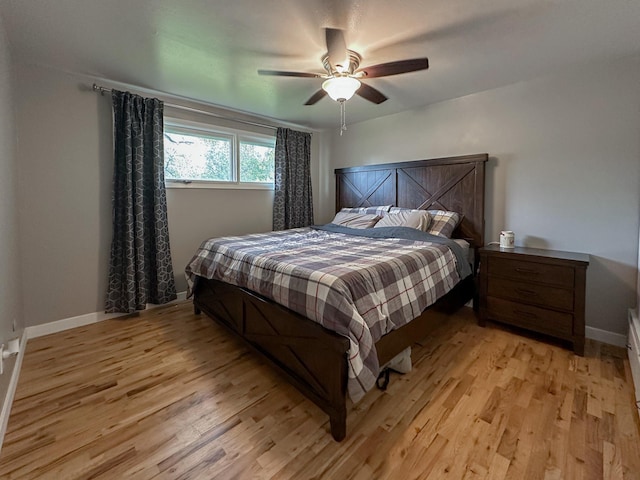 604 27th Ave NE, Great Falls, MT 59404 - bedroom featuring light wood finished floors, a ceiling fan, and baseboards