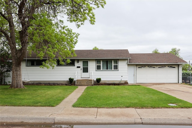 604 27th Ave NE, Great Falls, MT 59404 - single story home with a garage, concrete driveway, a front lawn, and roof with shingles