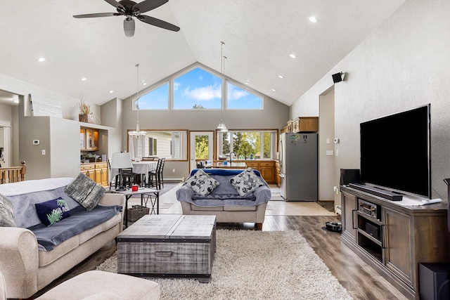 207 Cyprus Dr, Butte, MT 59701 - living room featuring light wood-style flooring, a ceiling fan, high vaulted ceiling, and recessed lighting