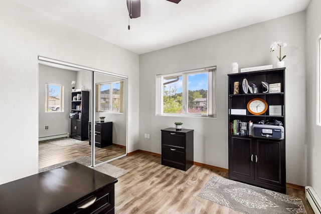 207 Cyprus Dr, Butte, MT 59701 - office with a baseboard heating unit, light wood finished floors, ceiling fan, and baseboards