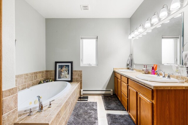 207 Cyprus Dr, Butte, MT 59701 - bathroom featuring a baseboard heating unit, plenty of natural light, double vanity, and tile patterned floors