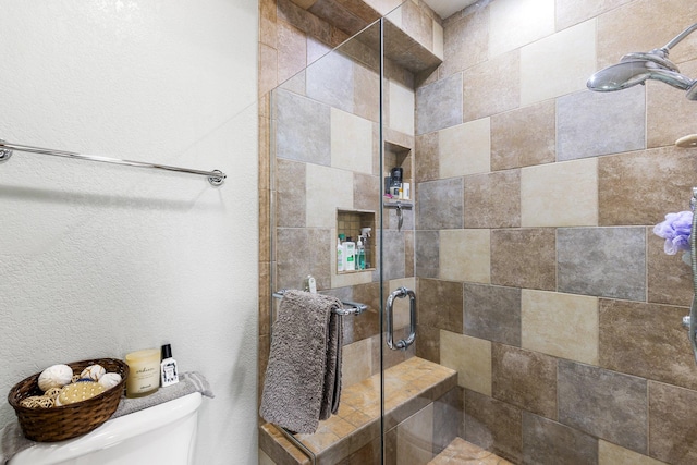 207 Cyprus Dr, Butte, MT 59701 - full bathroom with toilet, a shower stall, and a textured wall