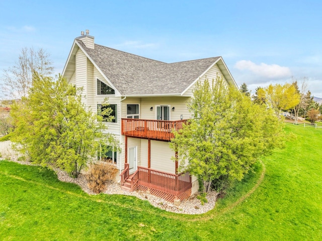 207 Cyprus Dr, Butte, MT 59701 - rear view of property with a shingled roof, a yard, a chimney, and a deck