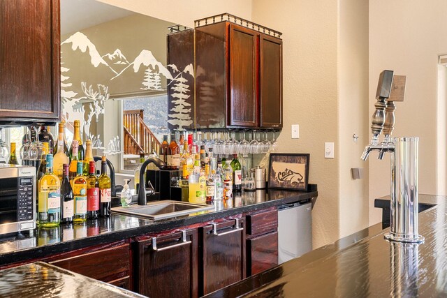 207 Cyprus Dr, Butte, MT 59701 - indoor dry bar featuring dishwasher and a textured wall