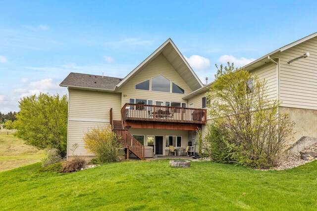 207 Cyprus Dr, Butte, MT 59701 - rear view of house with a deck, stairway, and a lawn