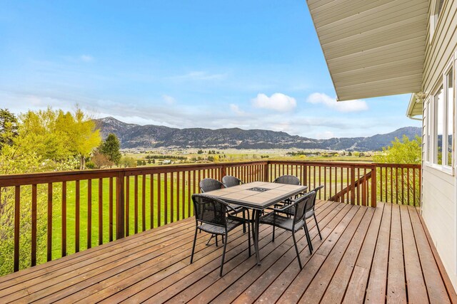 207 Cyprus Dr, Butte, MT 59701 - wooden deck featuring a mountain view and outdoor dining area