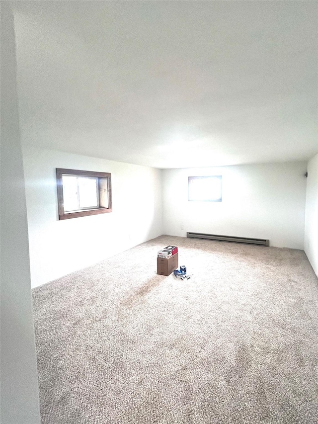 1807 1st St E, Polson, MT 59860 - carpeted spare room featuring plenty of natural light and a baseboard heating unit