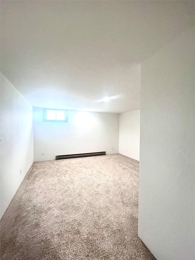 1807 1st St E, Polson, MT 59860 - carpeted spare room with a baseboard heating unit