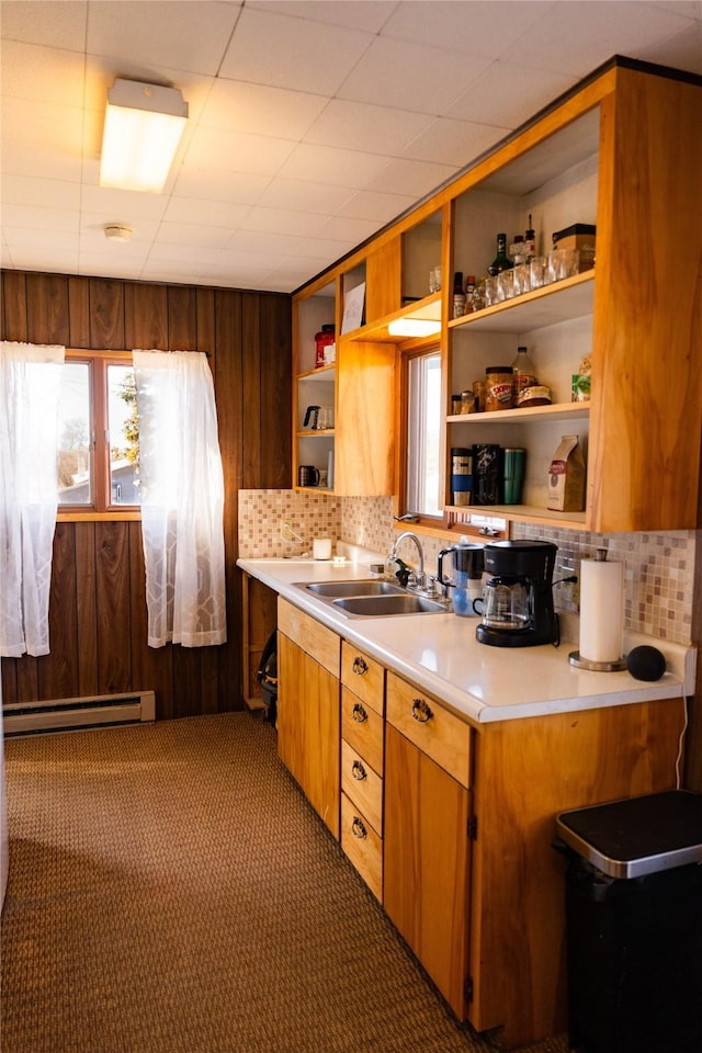 1807 1st St E, Polson, MT 59860 - kitchen featuring a baseboard radiator, open shelves, decorative backsplash, light countertops, and carpet flooring