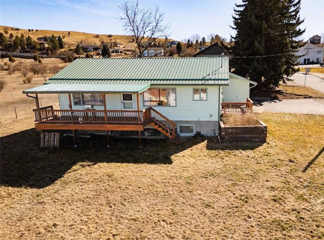 1807 1st St E, Polson, MT 59860 - back of property featuring metal roof and a deck