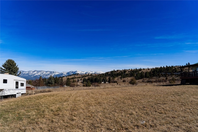 1807 1st St E, Polson, MT 59860 - view of green lawn with a mountain view and a view of rural / pastoral area